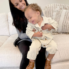 Load image into Gallery viewer, mom sitting holding baby on her lap baby wearing white corduroy jumpsuit laughing