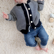 Load image into Gallery viewer, Baby laying wearing blue denim jeans and white shirt underneath navy striped cotton cardigan