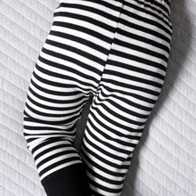 Load image into Gallery viewer,  baby legs wearing black and white  striped cotton baby leggings with black cuff at bottom