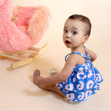 Load image into Gallery viewer, Toddler sitting next to pink flamingo rocking chair wearing blue and pink cheetah tankini