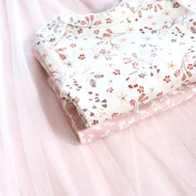 Load image into Gallery viewer, white and pink baby floral onesies folded on top of each other