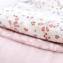 Load image into Gallery viewer, close up of white and pink floral design on baby onesie