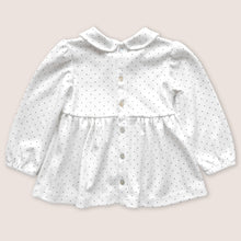 Load image into Gallery viewer, Back of white baby tunic with navy blue polka dots and peter pan collar, featuring mother of pearl buttons