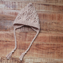 Load image into Gallery viewer, latte colored knit bonnet on brown background