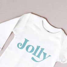 Load image into Gallery viewer, white long sleeved baby onesie with the word jolly written on it in blue laying on a grey background
