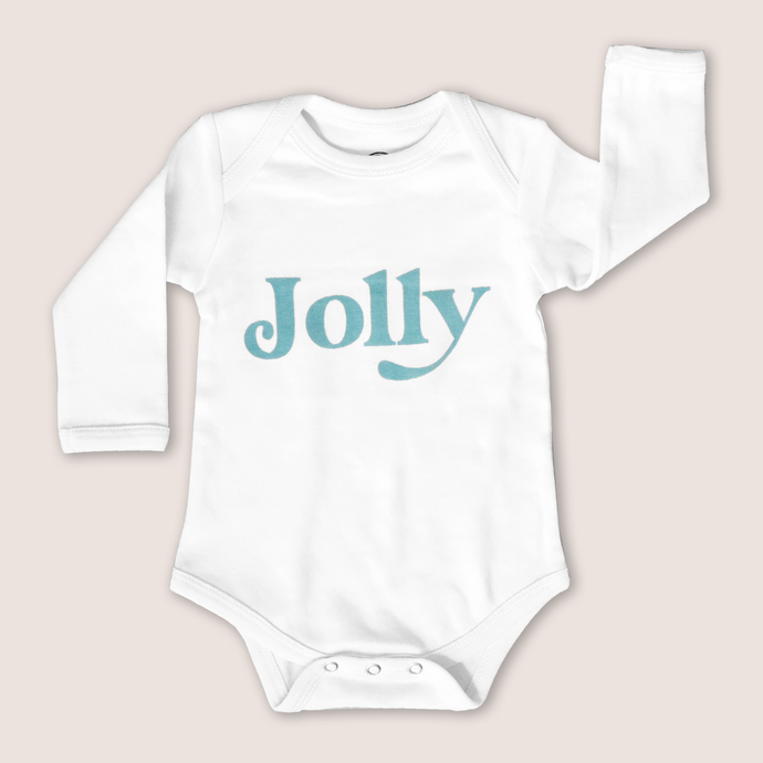 White long-sleeved baby onesie with the word jolly written on it in blue on a grey background