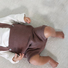 Load image into Gallery viewer, Baby laying wearing white mock neck long sleeve shirt and brown cotton knit jumper

