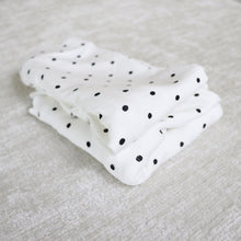 Load image into Gallery viewer, Baby cotton long sleeved white shirt with black polka dots and matching cotton white pants with black polka dots folded on top of each other
