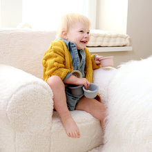 Load image into Gallery viewer, Baby sitting on chair playing wearing baby denim cotton romper and yellow knit pom pom cardigan
