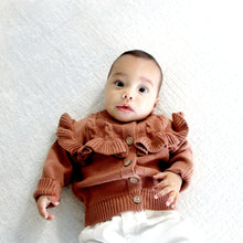 Load image into Gallery viewer, baby laying wearing brown baby flutter long sleeved cardigan
