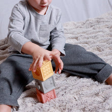 Load image into Gallery viewer, Baby sitting playing wearing grey long sleeved shirt and charcoal baby pants with banded leg opening
