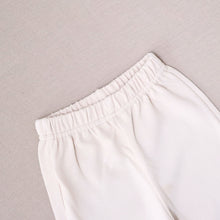 Load image into Gallery viewer, Elasticized waist of cream baby pants
