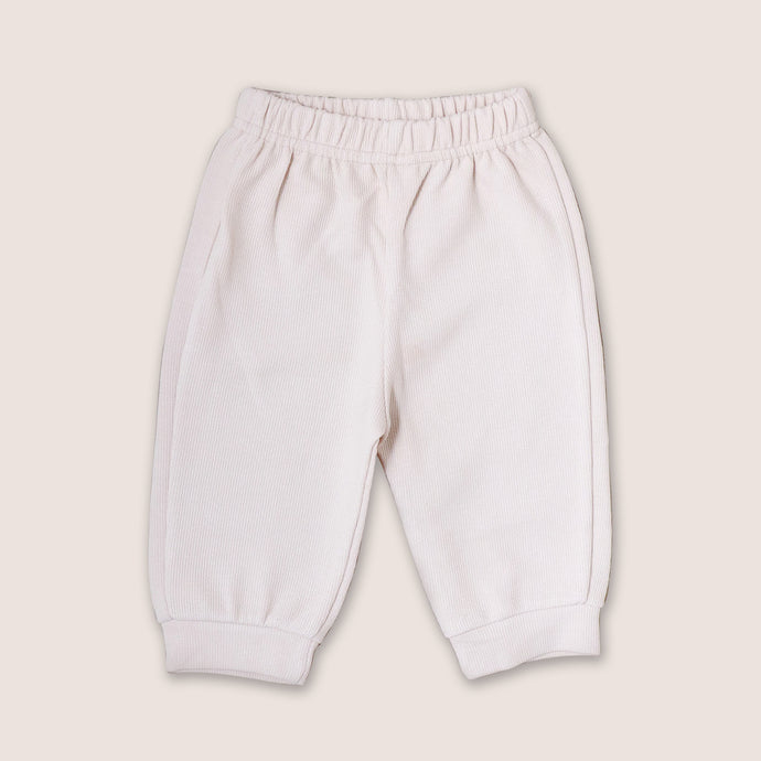 Baby cream pants with elasticized waist and banded leg opening