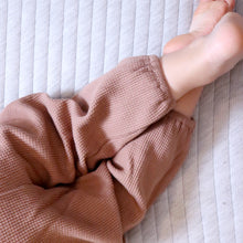 Load image into Gallery viewer, Baby&#39;s legs showing wearing brown waffle pants
