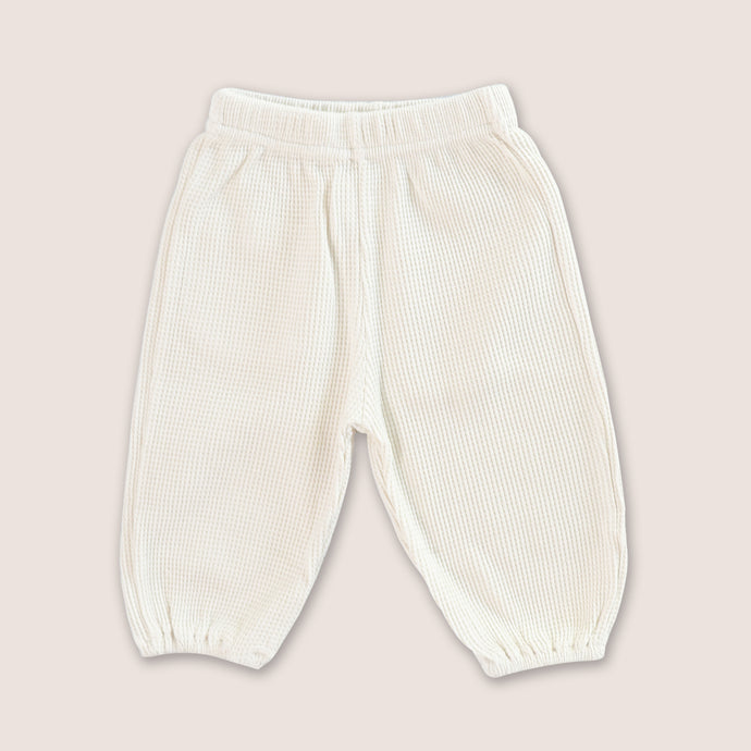 Baby cream waffle pants with elasticized leg openings