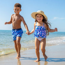 Load image into Gallery viewer, Children holding hands running on the beach

