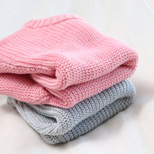 Load image into Gallery viewer, Pink and grey knit baby sweaters folded on top of each other
