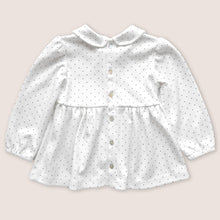Load image into Gallery viewer, Back of white baby tunic with navy blue polka dots and peter pan collar, featuring mother of pearl buttons 
