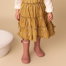 Load image into Gallery viewer, toddler standing wearing gold gingham tiered dress and pink rainboots
