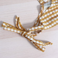 Load image into Gallery viewer, hand tied strap in bow of gold gingham tiered toddler dress
