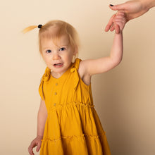 Load image into Gallery viewer, baby standing holding hands wearing yellow gold strapless tiered dress

