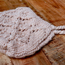 Load image into Gallery viewer, latte colored knit baby bonnet on brown background
